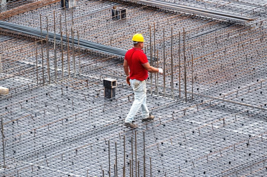 Reinforcing steel cages and rebar mats prepared for structural concrete placement.