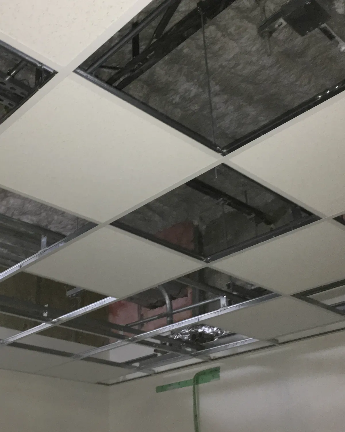 Reflected ceiling plans, grid components, tile samples, and ceiling accessories