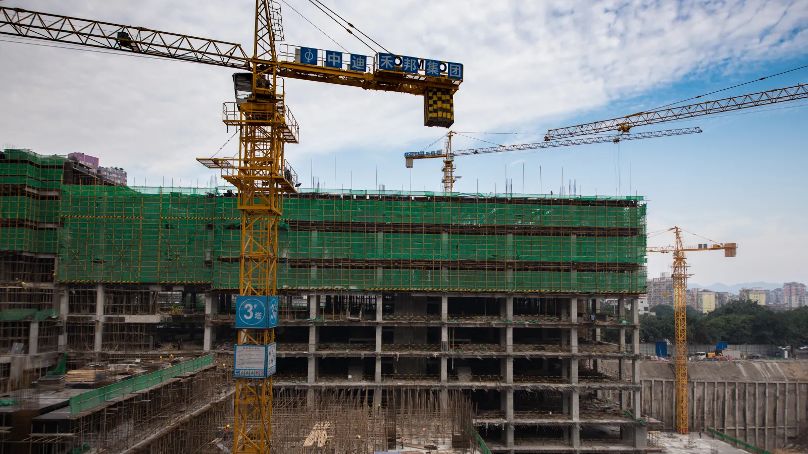 Modern mixed-use commercial building under construction with retail and office space