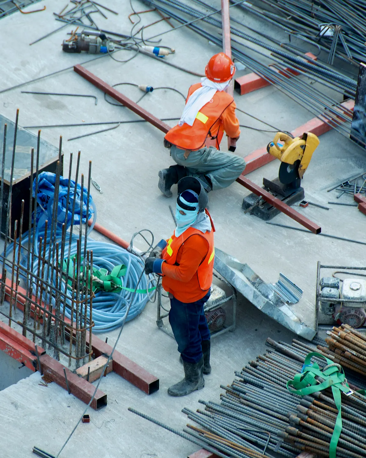 Concrete plans and measuring tools beside reinforcement and formwork details