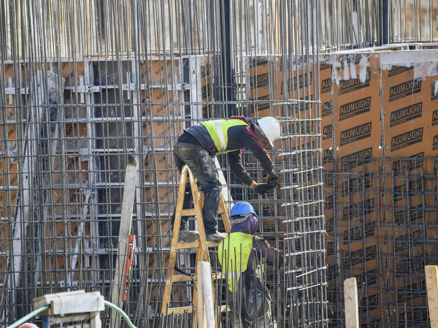 Reinforced concrete foundation with formwork, rebar, and varied elevations