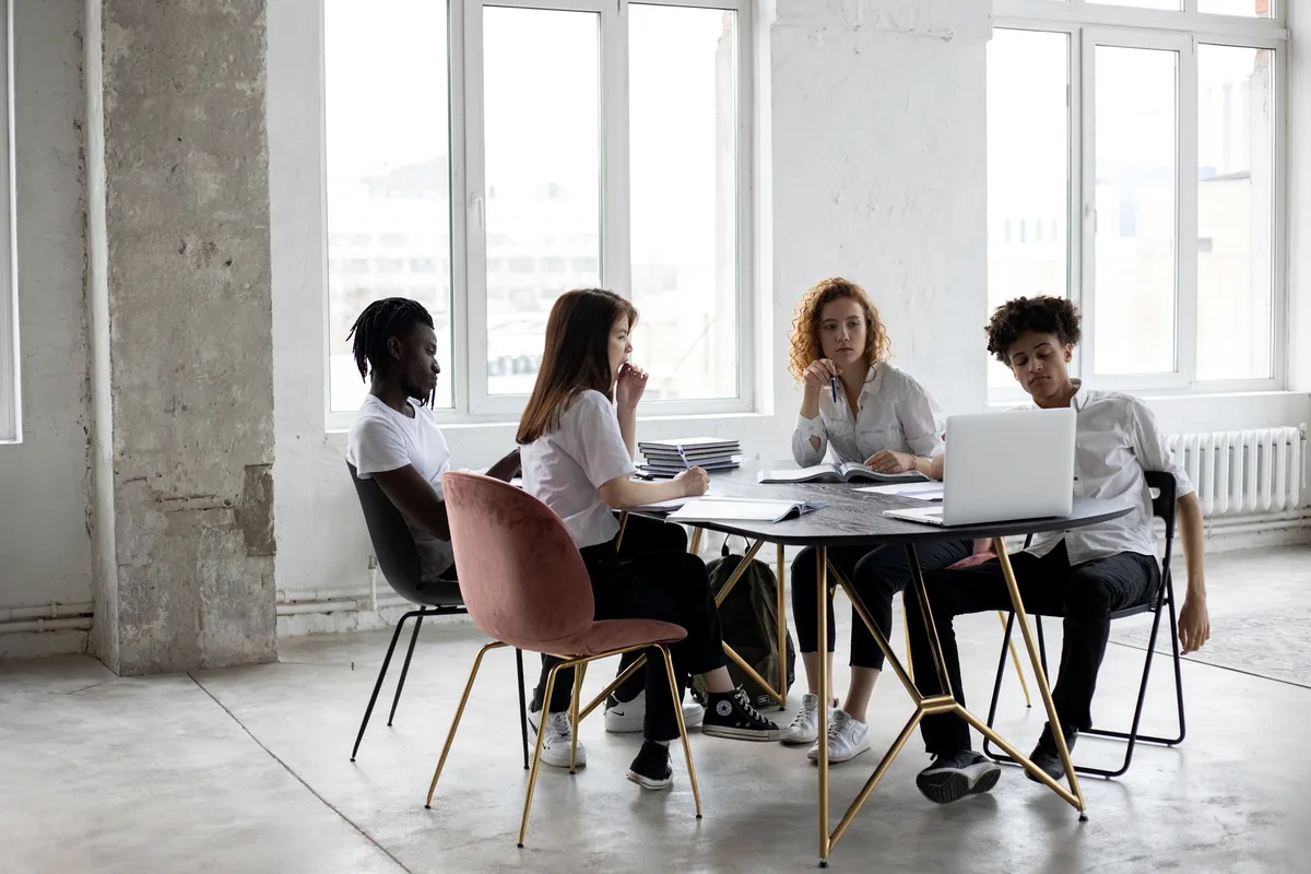 Project team coordinating work in a U.S. office for construction bid management