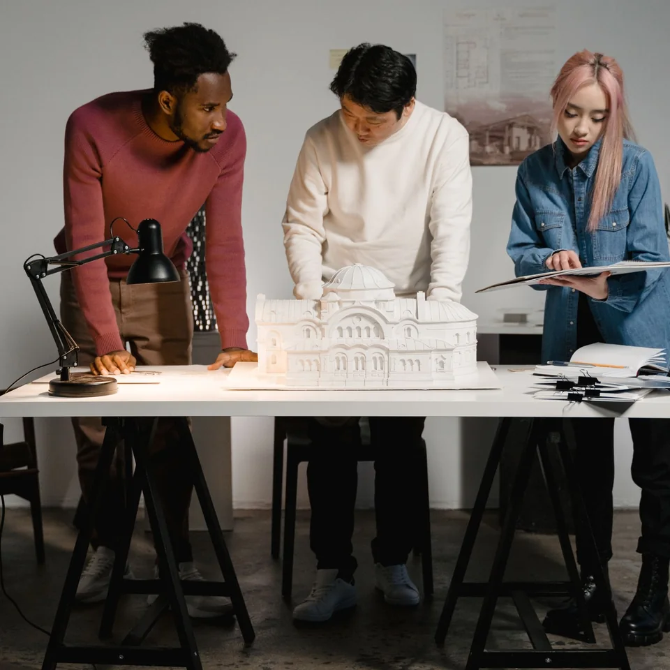 Project team evaluating an early building model for feasibility and budget planning