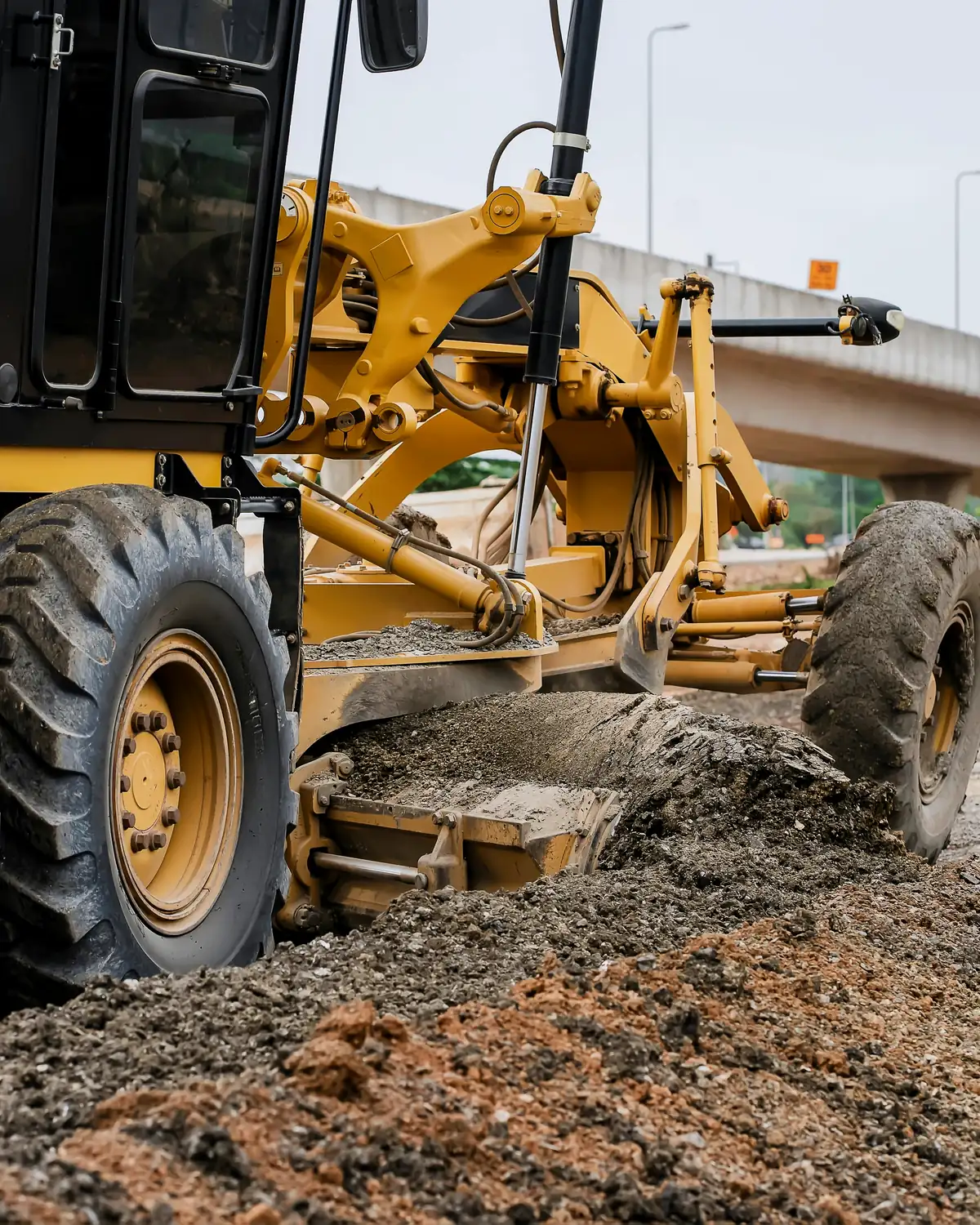 Excavators and grading equipment preparing a large construction site