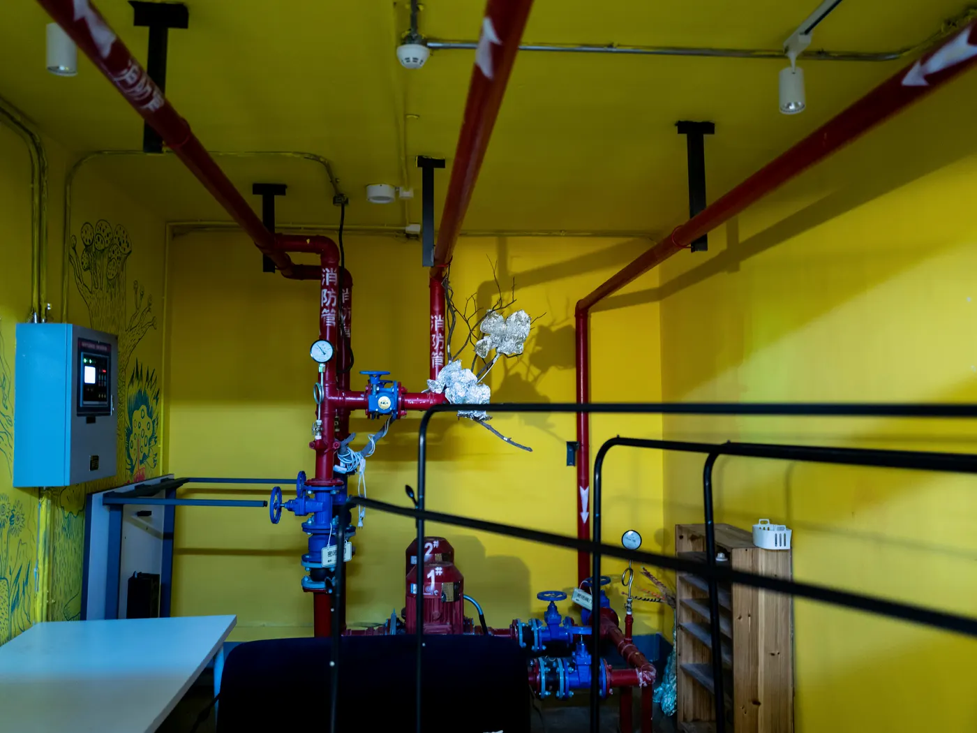 Commercial fire-protection system with sprinkler piping, valves, equipment, and ceiling obstructions