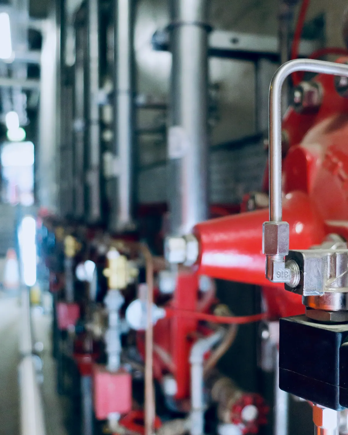 Sprinkler fitter installing commercial fire-protection piping and devices