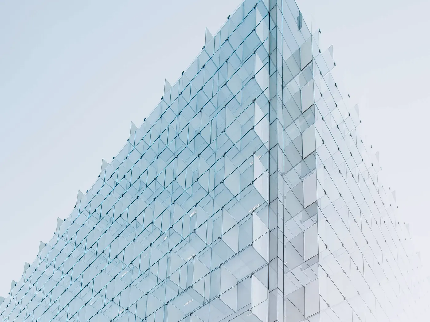 Commercial facade with curtain wall modules, glass types, entrances, and access equipment