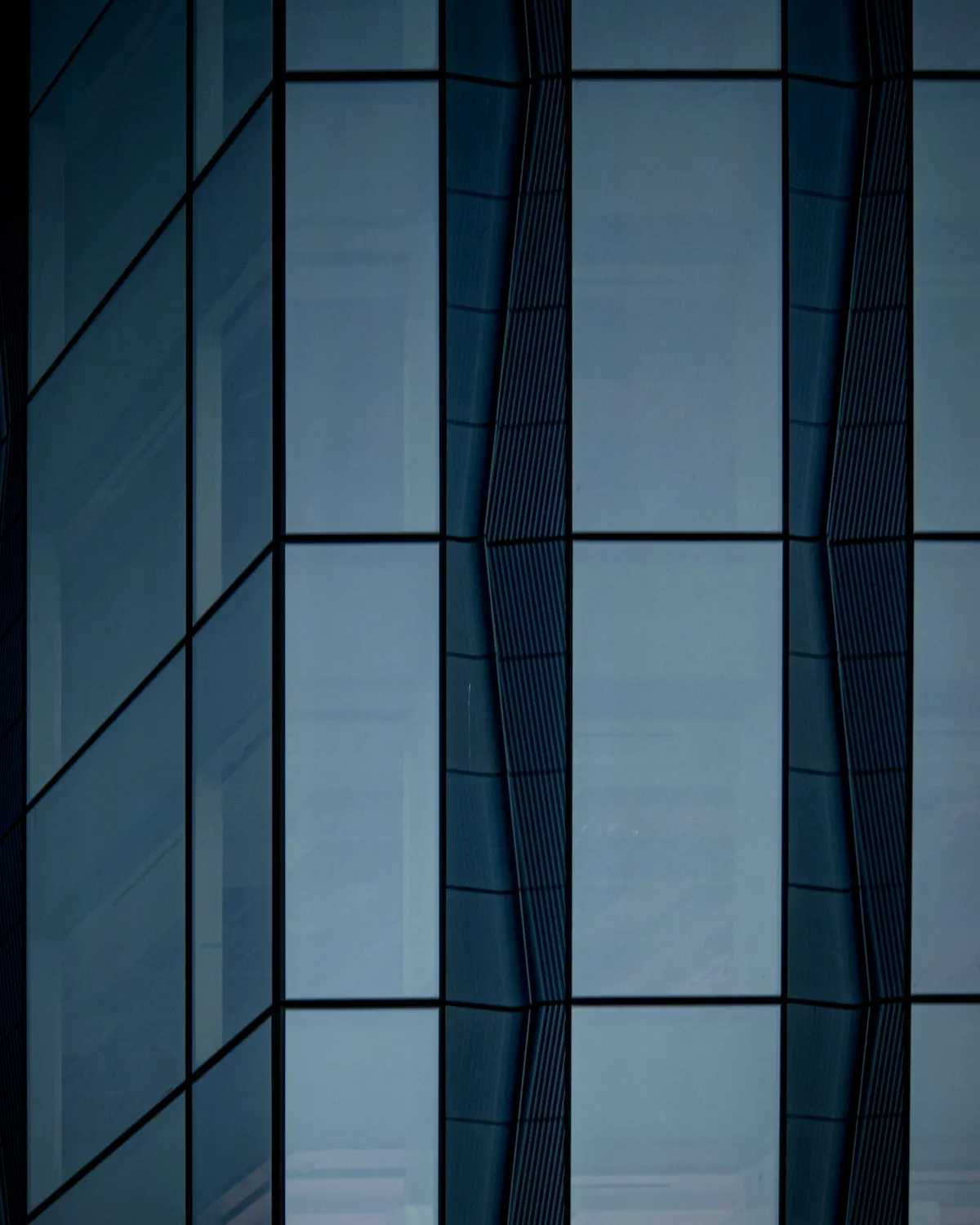 Glazing crew installing commercial curtain wall and glass panels