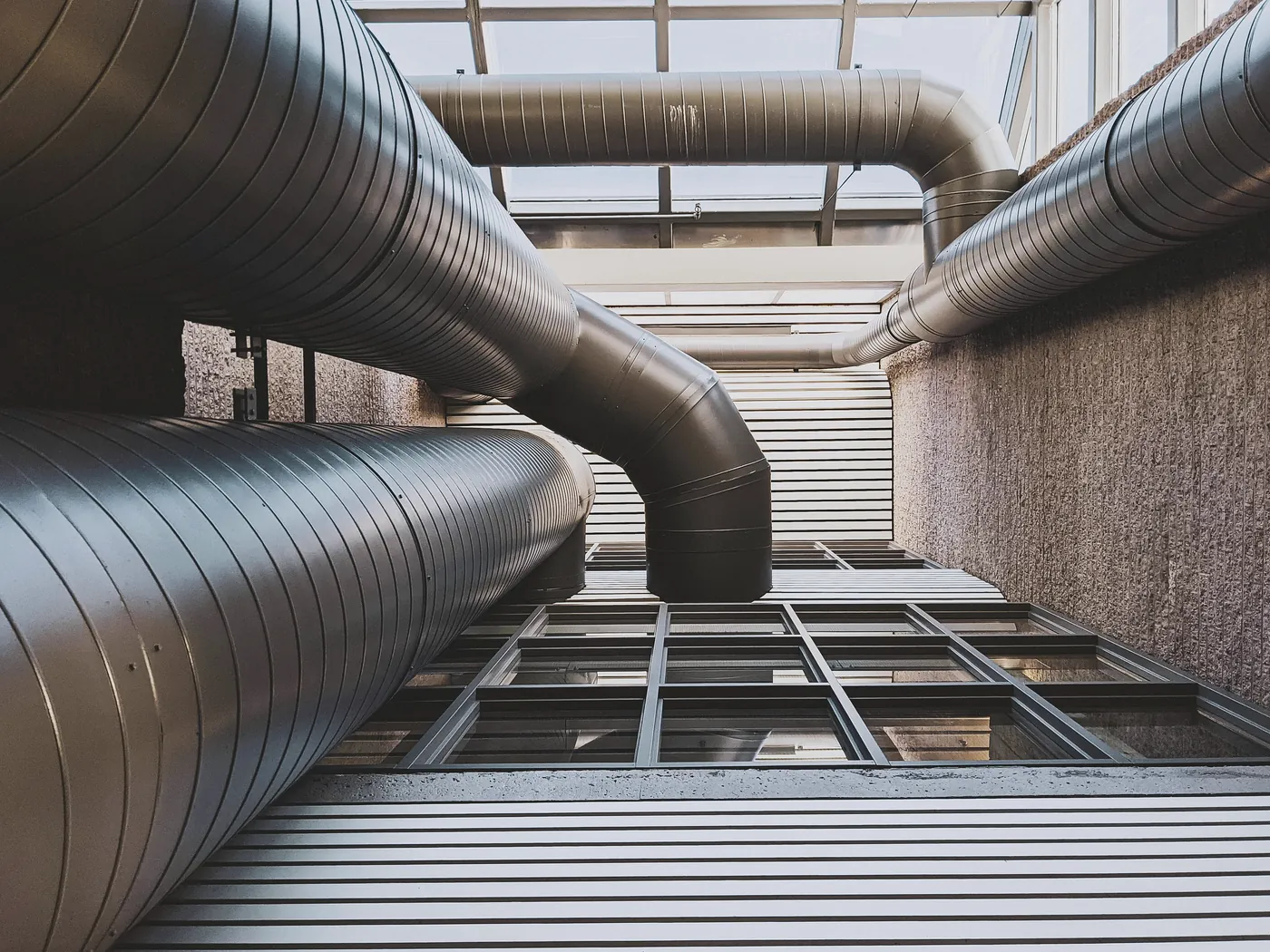 Coordinated mechanical room with ductwork, piping, equipment, and access constraints