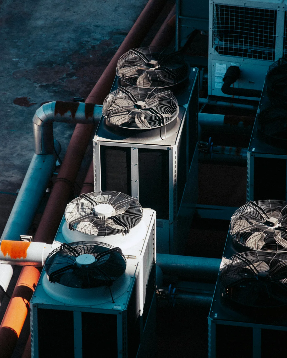 Commercial HVAC installation with ductwork, piping, and mechanical equipment