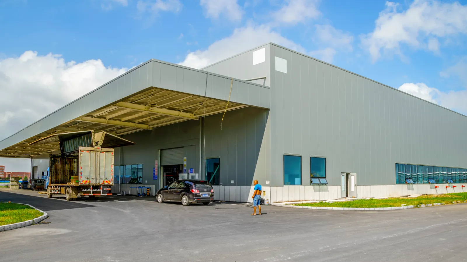 Large manufacturing and warehouse facility with loading docks and industrial structures