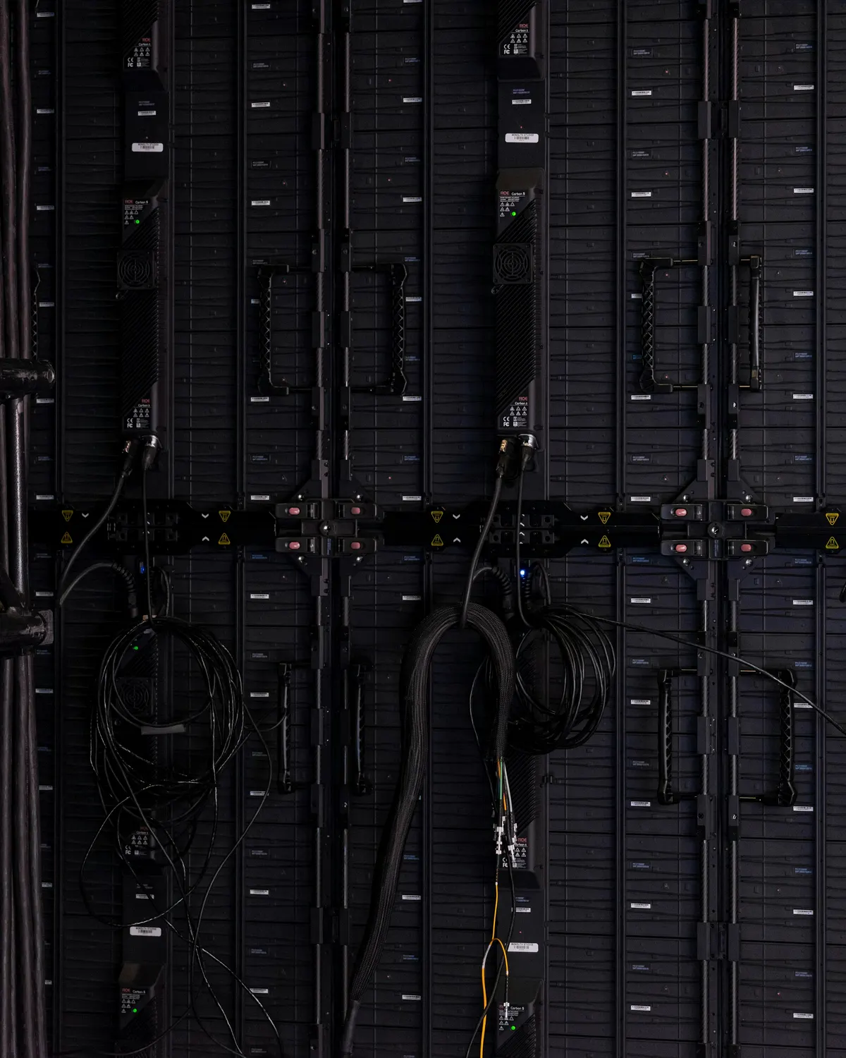 Technician installing structured cabling and security devices in a commercial building