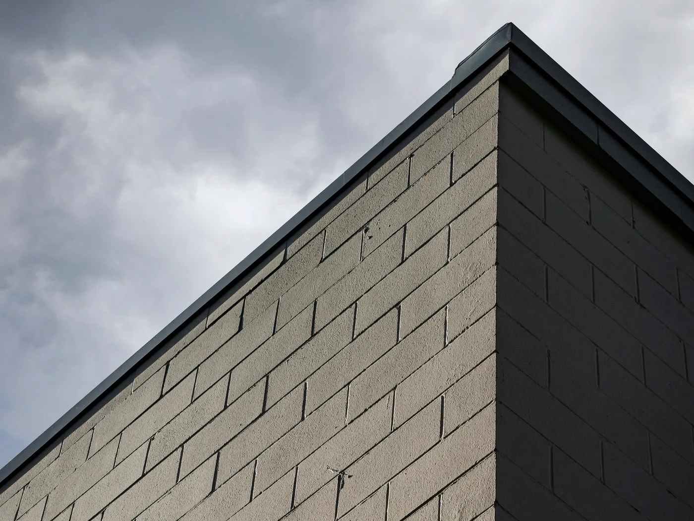 Masonry wall with openings, lintels, reinforcement, and veneer transitions