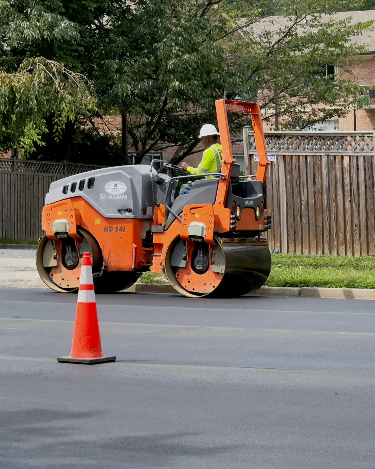 Paving plans, asphalt and aggregate samples, striping layout, and measuring tools