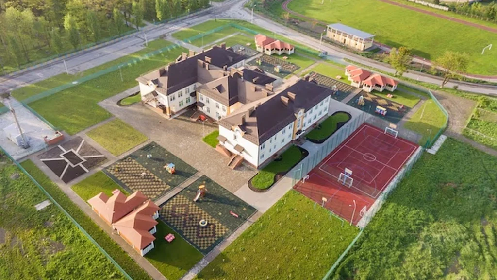 Large organized development shown from above with multiple buildings and phased site work.