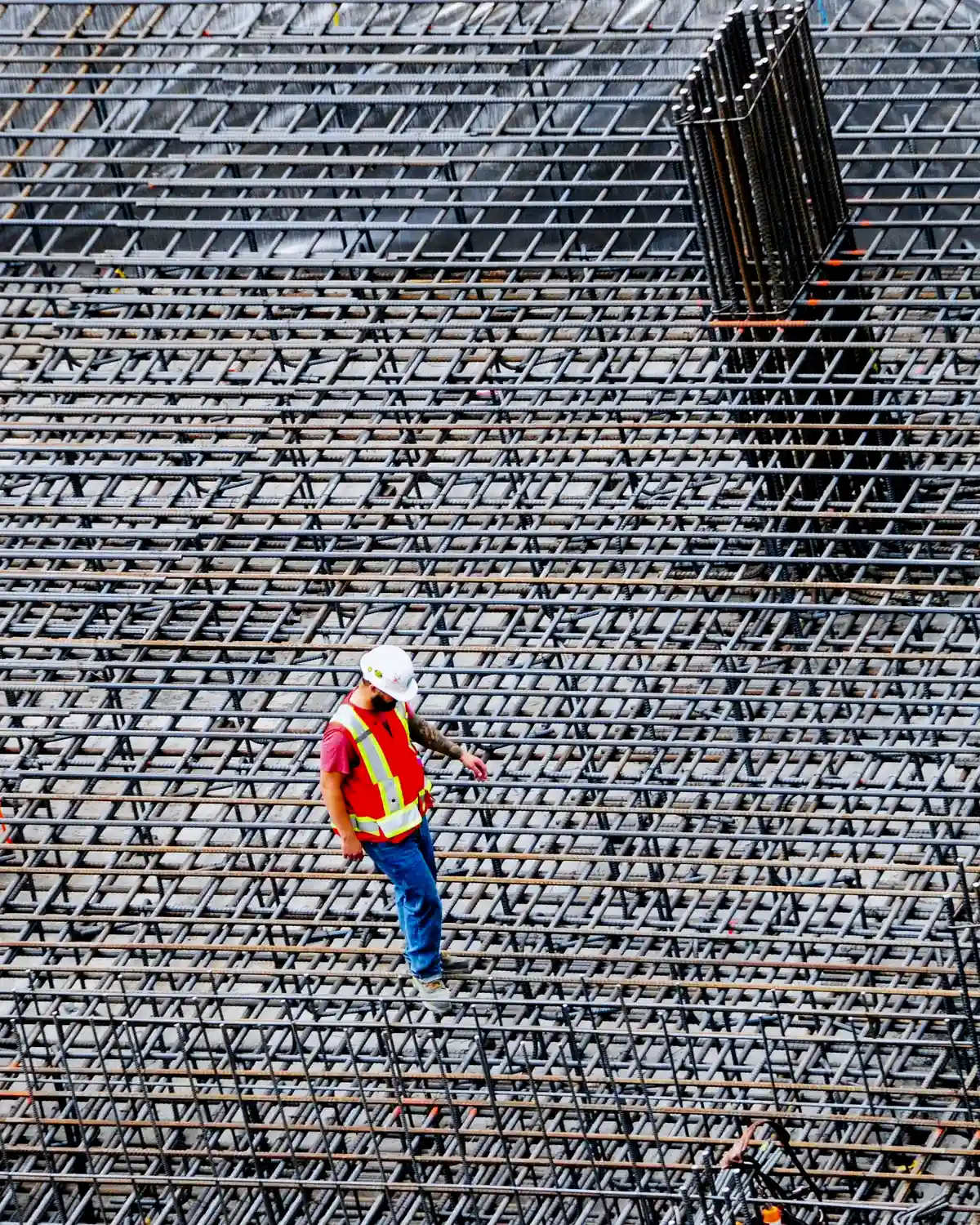 Rebar crew placing reinforcing steel in a concrete foundation