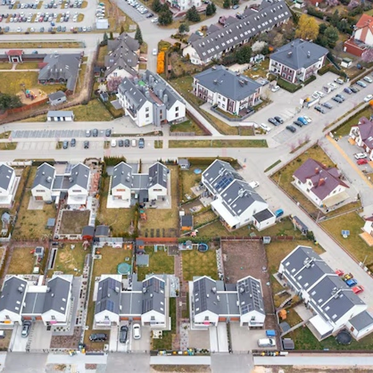 Residential development with repeated buildings at different construction stages and phased releases.