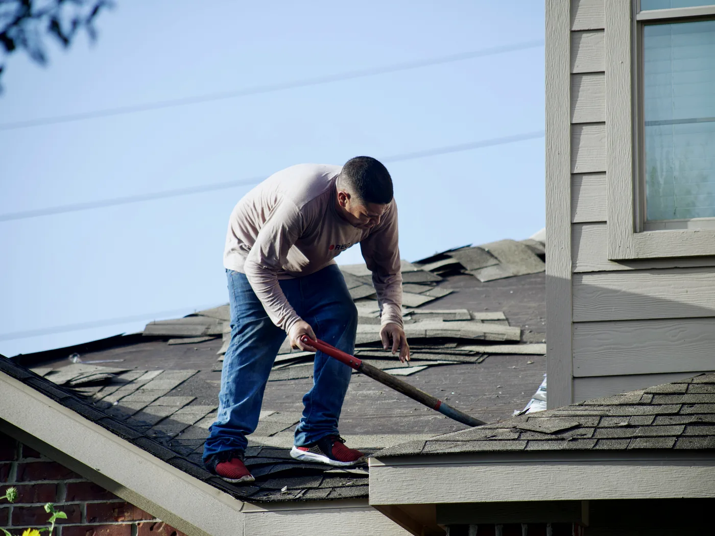 Commercial roof with tapered insulation, drains, parapets, curbs, and penetrations