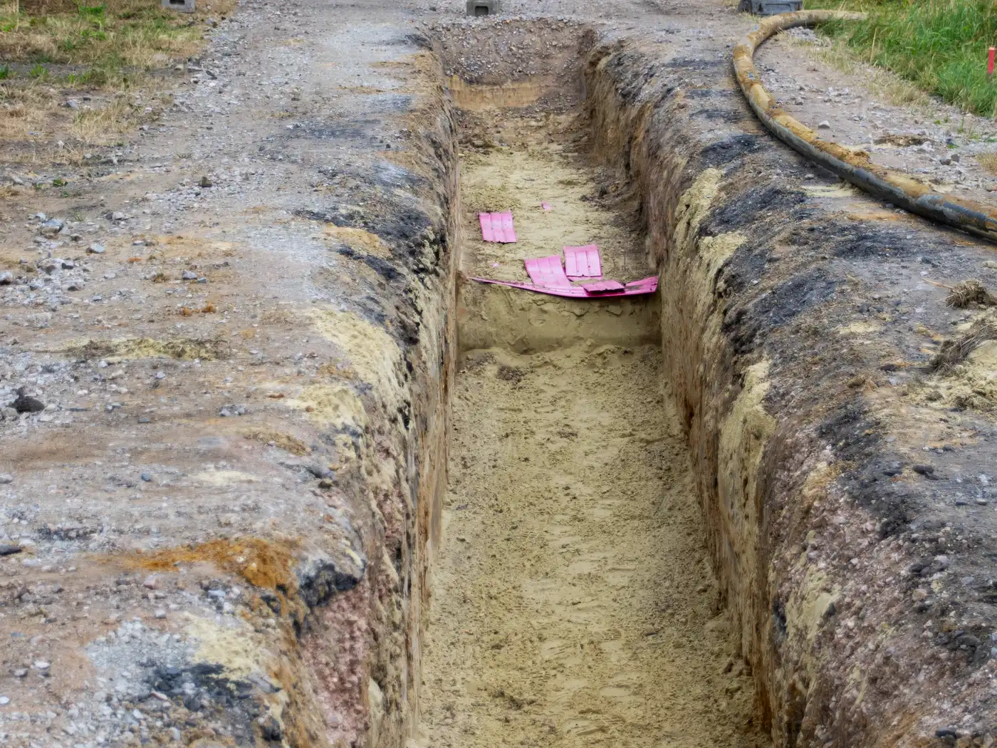 Underground utility work with pipe crossings, structures, trench access, and restoration limits