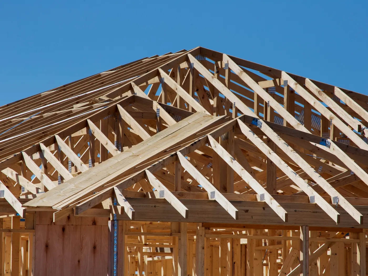 Wood framing with varied wall heights, floor systems, roof framing, and connectors