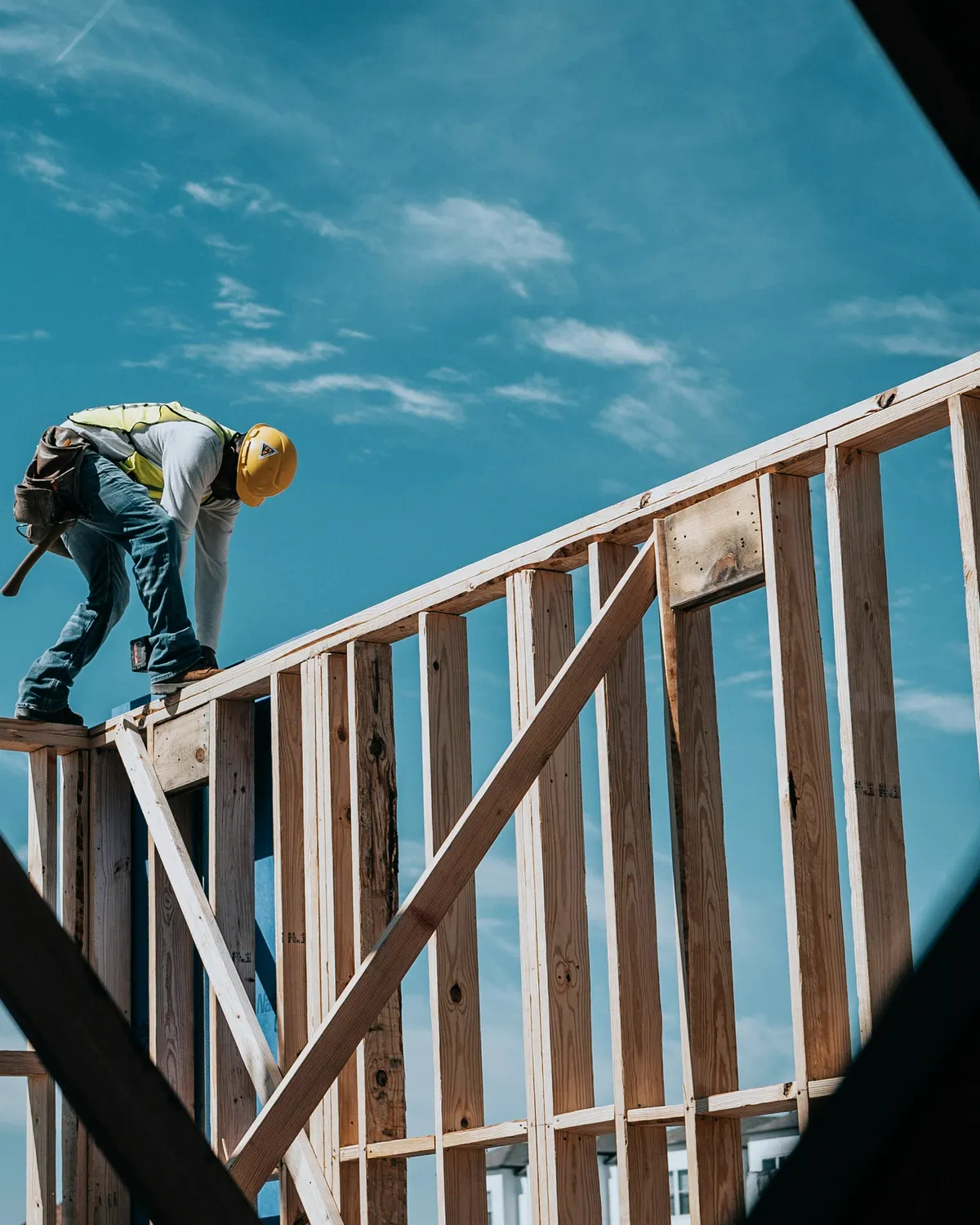 Multifamily wood framing with studs, floor joists, sheathing, and openings