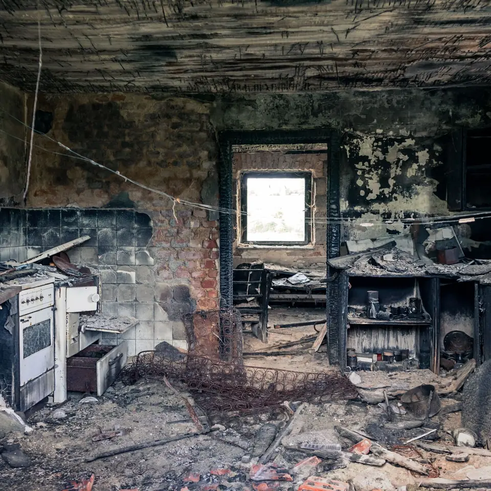 Fire-damaged building interior requiring insurance restoration estimating